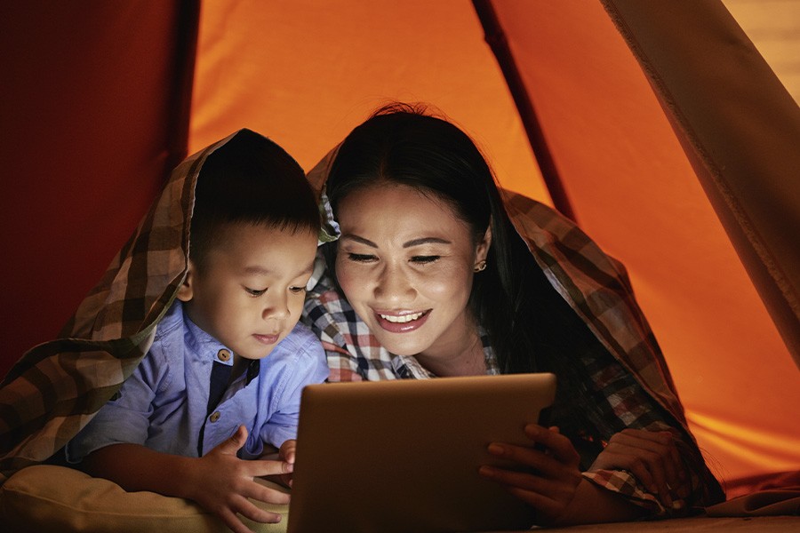 Mother and child reading together