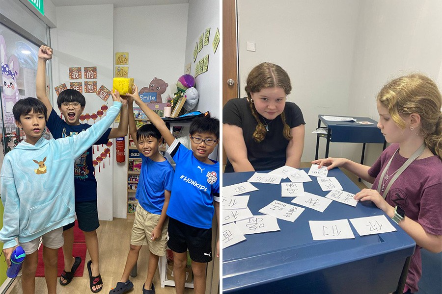 Two children play with cards; one holds a cup, showcasing a fun learning environment at a top tuition centre in Singapore